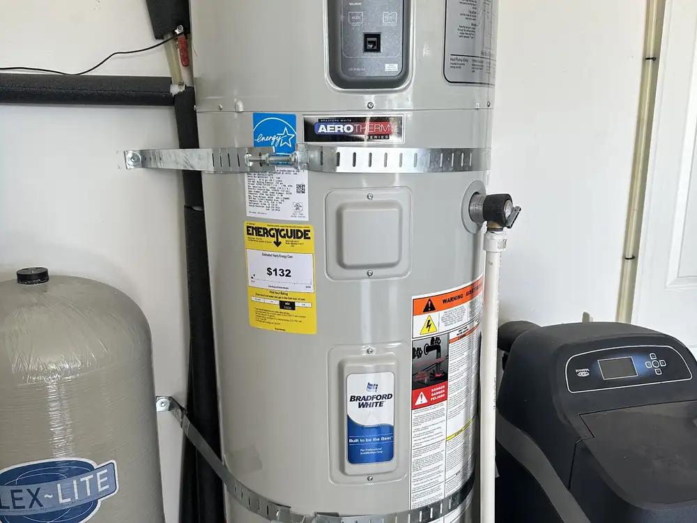 A new heat-pump water heater, expansion tank and softener plumbed side by side by CSR Plumbing